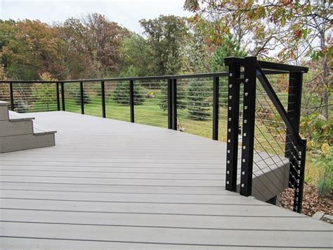 Here we have the atlantis rail systems on a very classic wood deck with large wood posts, base trim and caps. Black Aluminum Cable Railing - Lakeville, MN