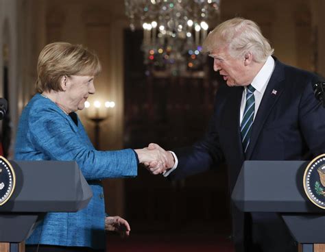 the internet reacts to trump and merkel s awkward handshake moment national politics herald