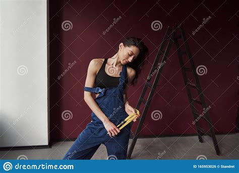 Beautiful Female Worker Young Housewife Decided To Glue Wallpaper In Her New House In The Room