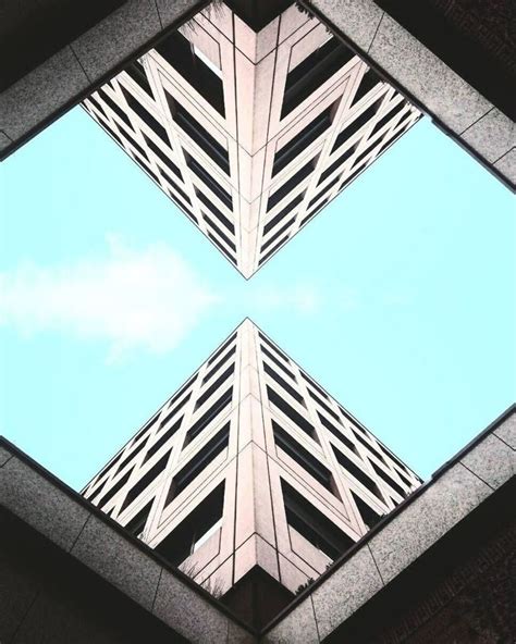 This Picture Has Symmetry By Showing Two Identical Buildings One Is On
