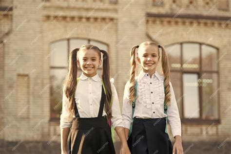 Premium Photo Lucky To Meet Each Other Cheerful Smart Schoolgirls