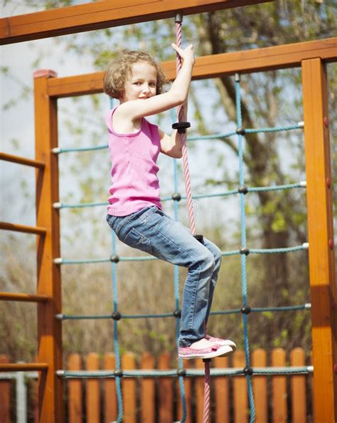 Young Girl Climbing Rope In Playground Stock Image Image Of Camera