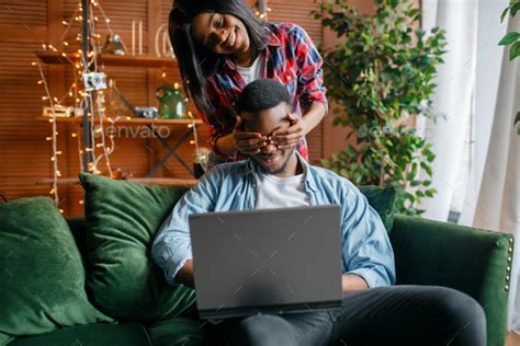 Black Couple With Laptop Having Fun On Sofa Stock Image Everypixel