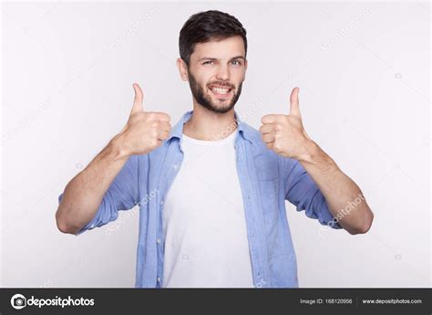 Portrait Of A Happy Young Successful Male Office Worker Giving Two