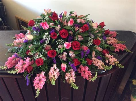 A Full Casket Spray For A Woman In All Pink Purple And Burgundy