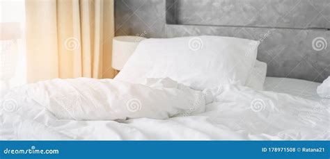 Wrinkle White Messy Blanket On Bed In Bedroom In Morning Stock Photo