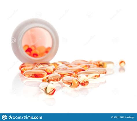 Shiny Vitamin E Capsule Spilling Out Of Pill Bottle Stock Image Image