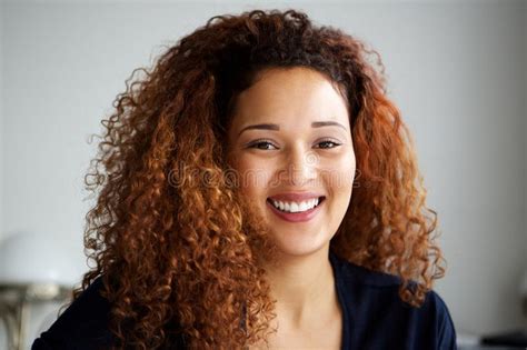 Close Up Attractive Young Woman With Curly Hair Smiling Stock Image