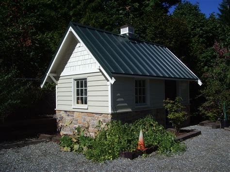 Retractable roof greenhouses and shadehouses keywords: Skyline Forest Green 2 - Metal Roof Specialties