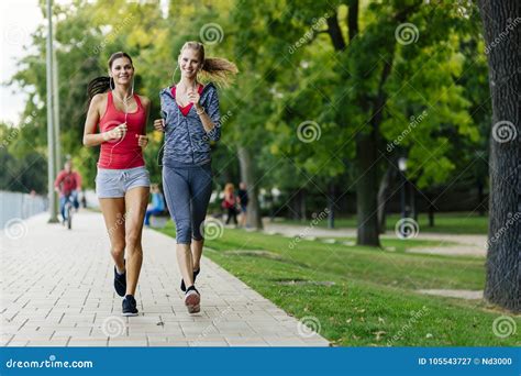 Two Women Jogging In Park Stock Image Image Of Active 105543727