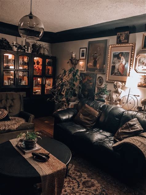 A Living Room Filled With Furniture And Pictures On The Wall