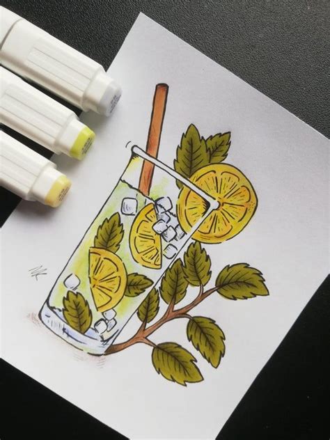 Two Markers Are Next To A Drawing Of A Drink With Lemons And Mints