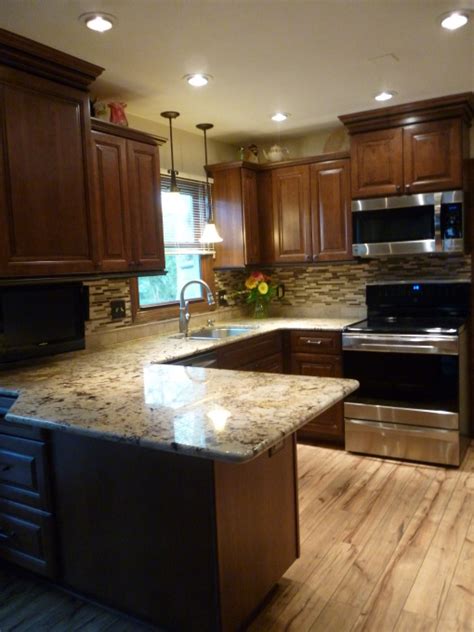 Considering a kitchen cabinet makeover but have a limited budget? Kitchen Makeover, Kitchen makeover with cherry cabinets ...