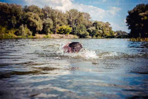The Young Man Swimming In The River Stock Image Image Of Competition