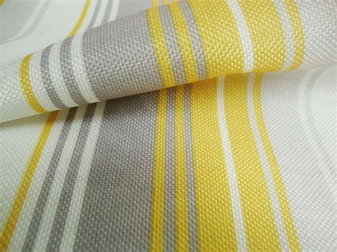 Products made from black and yellow stripe fabric. Nova Yellow Stripes Curtain Fabric - By Curtains n Fabx