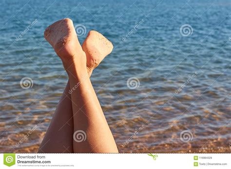Woman Sunbathing On Sea Beach Legs View Stock Photo Image Of Casual