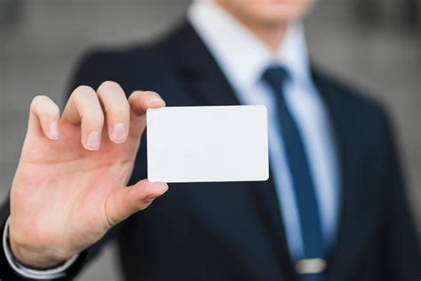 Businessman Holding Business Card Template Free Photo