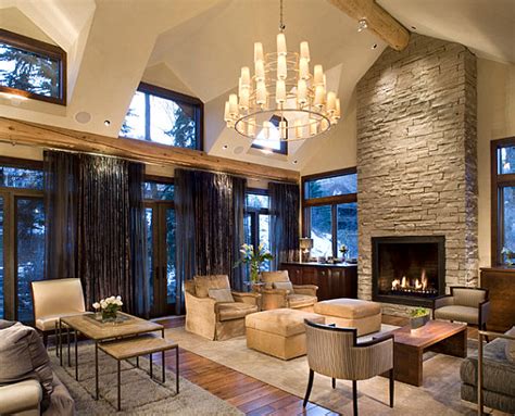 This modern stone fireplace is extended to the ceiling to add a complete contrast to the rest of the area. Modern Stone Fireplace Designs