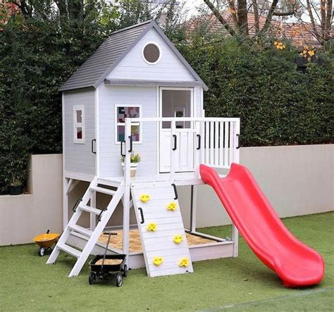 Cute Playhouse With Slide Climbing Wall And Sandbox Backyard House