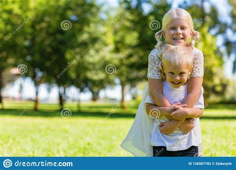 Cute Kids Hugging Each Other Very Strongly Stock Photo