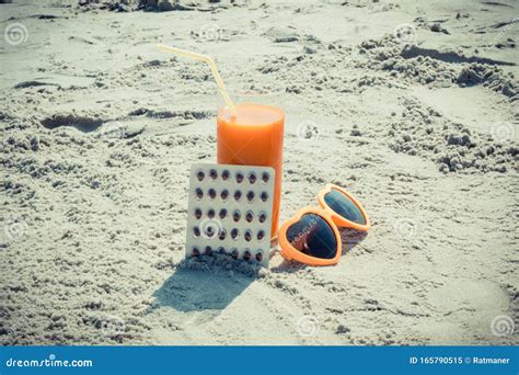Medical Pills Carrot Juice And Sunglasses On Sand At Beach Vitamin A And Beautiful Lasting