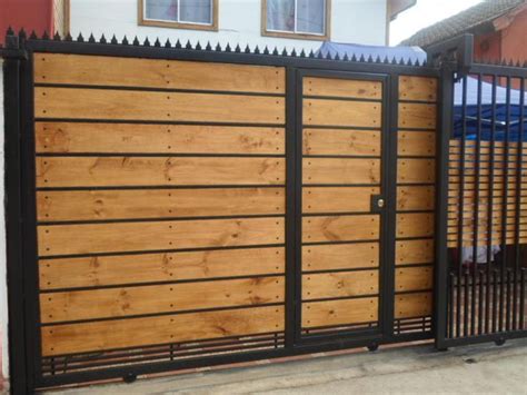 A Wooden Fence With Black Iron Bars On It