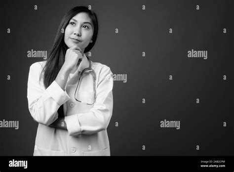 Young Beautiful Asian Woman Doctor In Black And White Stock Photo Alamy