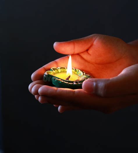 A Girl Holding Diya In Her Hand To Celebrate Diwali And Dhanteras Stock
