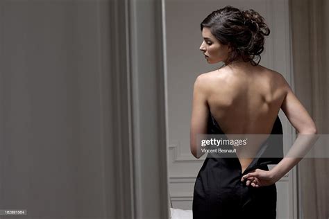 A Young Woman Unzipping Her Dress Photo Getty Images