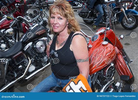 Woman Rider Sitting On Her Bike In The City Of Sturgis In South Dakota