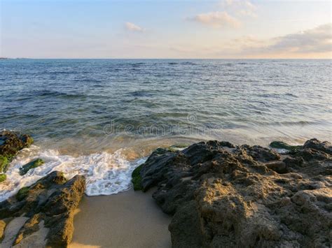 Wave Washing The Sandy Beach With Stones Stock Photo Image Of