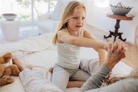 Beautiful Little Girl With Her Mother On Bed Cute Daughter Playing