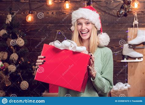 Young Woman With Christmas Present Boxes In Front Of Christmas Tree Winter Eve Night Emotion
