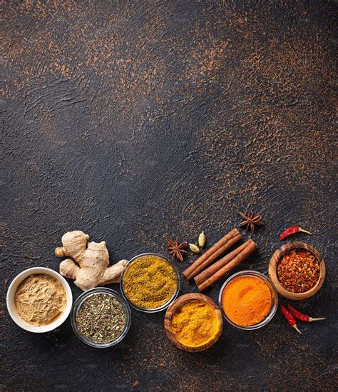 Traditional Indian Spices On Rusty Background Containing Paprika