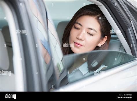Young Chinese Businesswoman Sitting In Car Back Seat Stock Photo Alamy