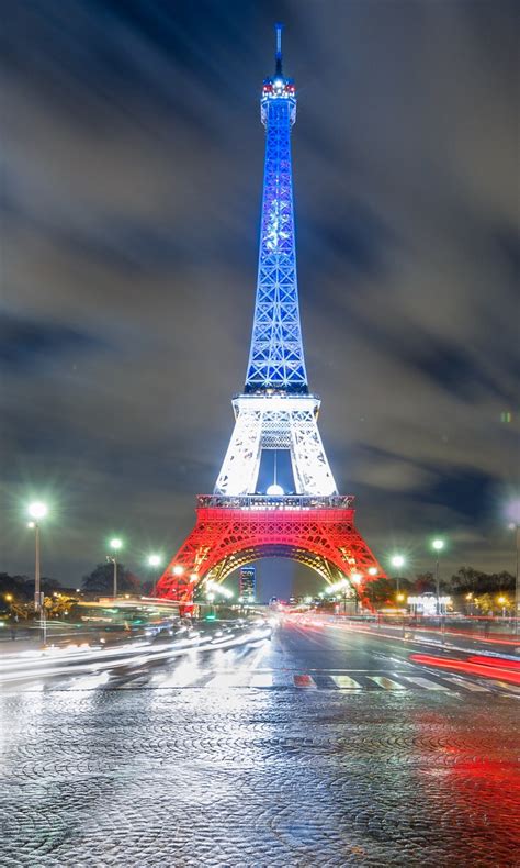 Blue White And Red Lighting Paris Eiffel Tower With Shallow Background