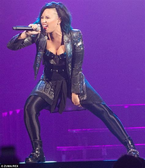Demi Lovato Amplifies Her Cleavage In Dominatrix Style Bustier As She Rocks Out On Stage In