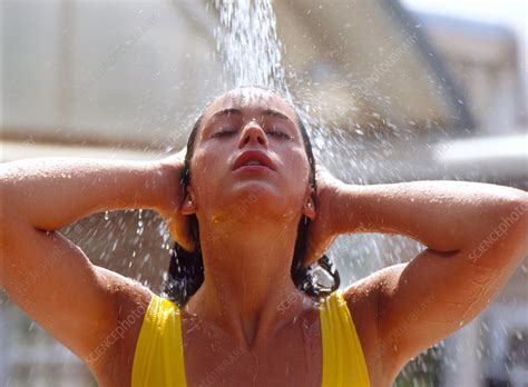woman taking outdoor shower stock image m985 0046 science photo library