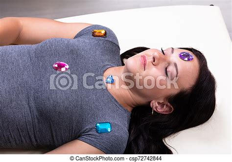Woman Being Hypnotized Photo Of Young Woman Undergoing Hypnotherapy