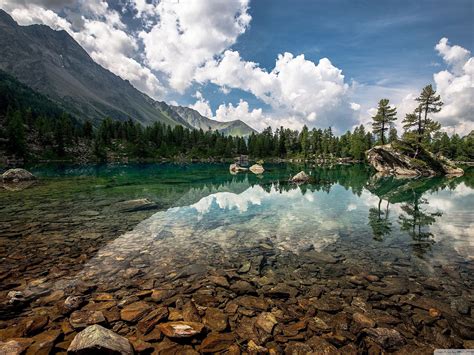 Natural Beauty Mountain Lake With Crystal Clear Water Bottom With