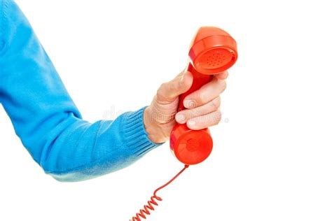 Hand Is Holding A Red Phone As An Emergency Call Concept Stock Photo Image Of Retro House