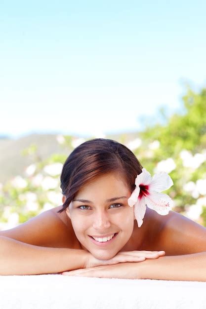 Premium Photo Relaxing With A Smile Smiling Young Woman Lying In A Day Spa