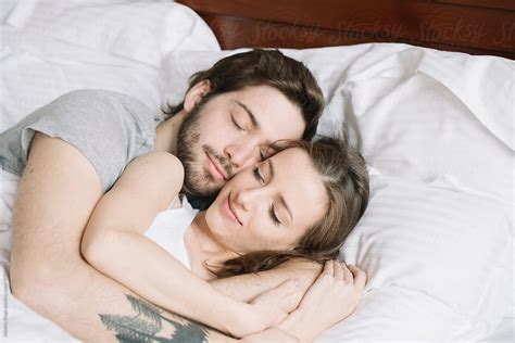 Couple Sleeping Hugging On Pillow By Stocksy Contributor Studio