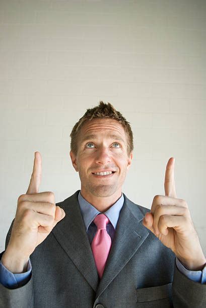 90 Happy Man In Suit One Finger Number 1 Hand Gesture Stock Photos