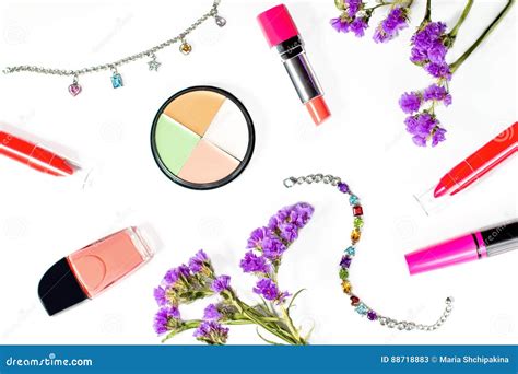 Cosmetics And Jewelry On White Background With Flowers Stock Image
