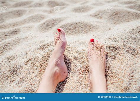 Female Feet With Red Pedicure In Beach Sand Stock Image Image Of