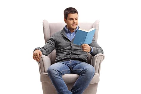 Young Man In An Armchair Reading A Book Stock Image Image Of Comfy