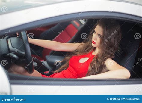 Beautiful Girl Driver Driving In Car Sensual Brunette Model Wea Stock