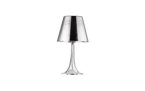 Miss k table lamp is designed by philippe starck using a new innovative material that appears metallic silver when off and becomes transparent when lit, exposing the opaque inner diffuser. Miss K Table Lamp - Design Within Reach