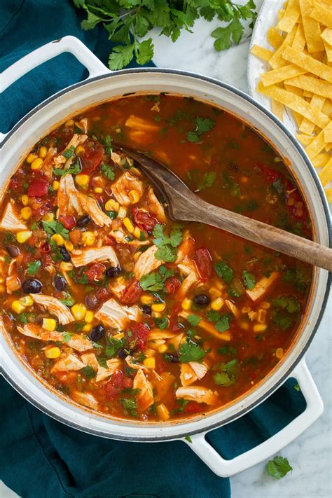 Chicken tortilla soup cooked on the stove using shredded rotisserie chicken and topped with homemade tortilla strips, fresh avocado and shredded jack cheese. Chicken Tortilla Soup - Cooking Classy
